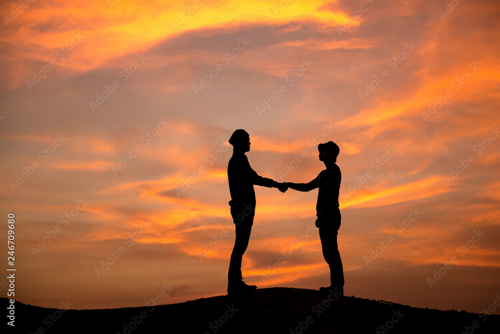 Silhouette couple at sunset