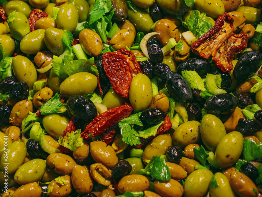 tasty Sicilian olives seasoned with olive oil, spicy pepper and parsley tasty Sicilian olives seasoned with olive oil, spicy pepper and parsley