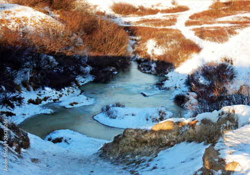 Little frozen creek at the beginning of winter in Kuujjuaq, Far North of Quebec