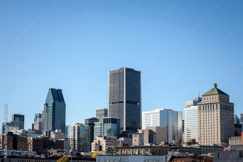 Montreal skyline, with the iconic buildings of the old Montreal (Vieux Montreal) and the CBD business skyscrapers taken from the port. Montreal is the main city of Quebec, and the 2nd city in Canada Montreal skyline, with the iconic buildings of the old Montreal (Vieux Montreal) and the CBD business skyscrapers taken from the port. Montreal is the main city of Quebec, and the 2nd city in Canada