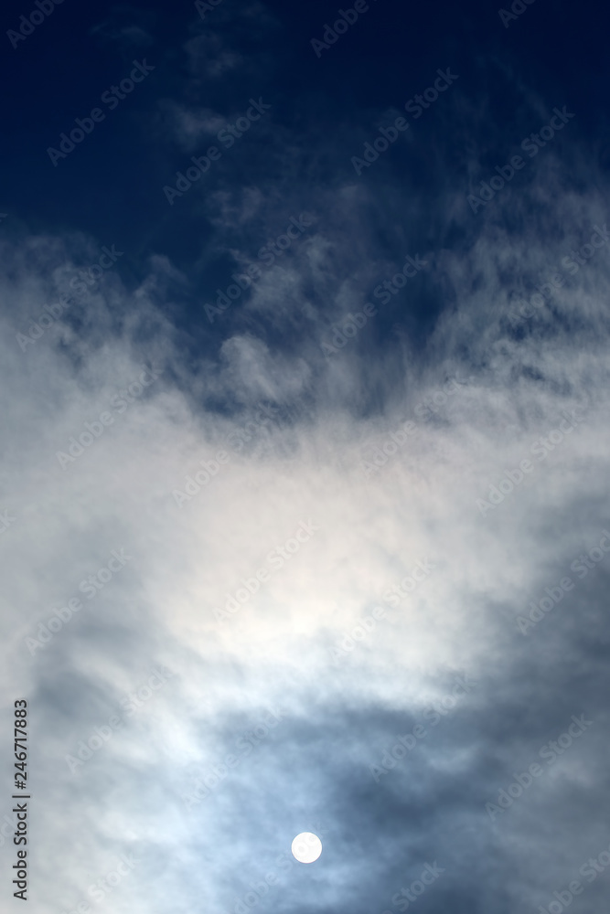 solar disk at noon through the clouds solar disk at noon through the clouds