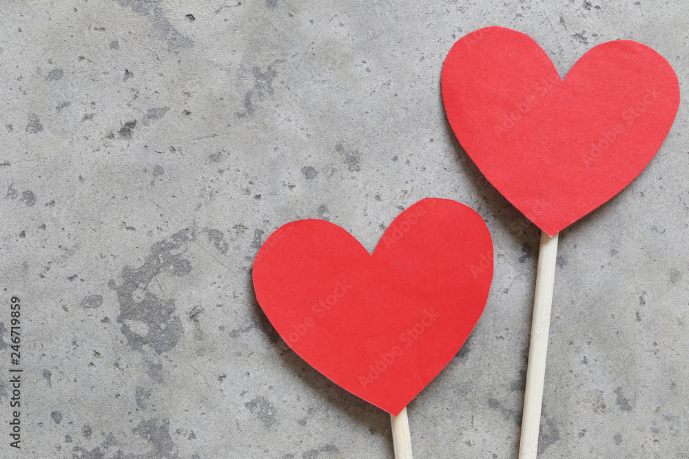 Red Heart paper on the concrete floor and have copy space.