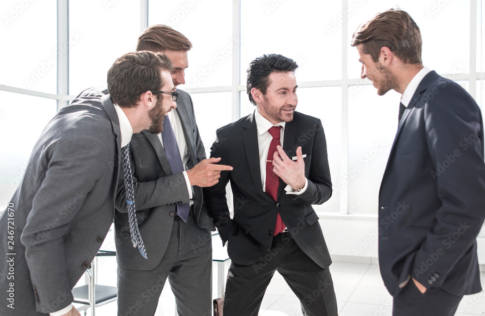 business team communicates standing in the office business team communicates standing in the office
