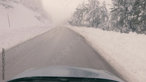 Driving through the fog on a snowy mountain road to Ziria ski center in Greece. photo