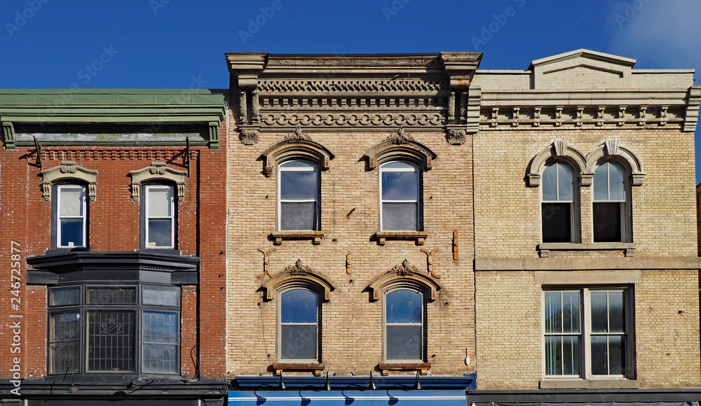 Facades of preserved 19th century commercial buildings of the type found in some older North American small town main streets Facades of preserved 19th century commercial buildings of the type found in some older North American small town main streets