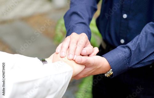 Woman and man holding hands to take care and help each other.Family concept and relationship