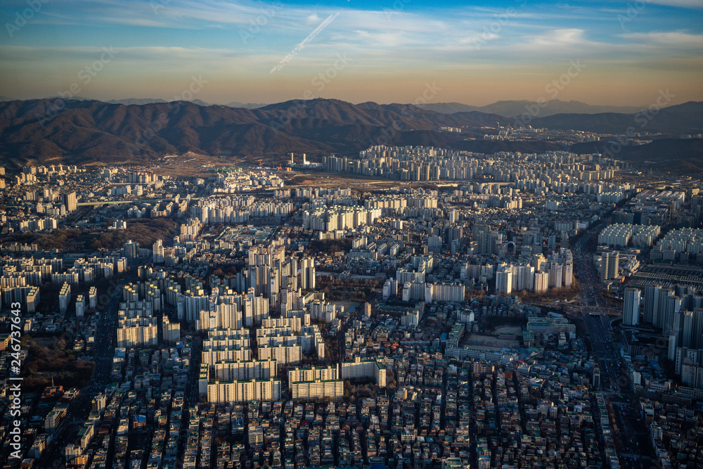 Aerial view cityscape of Seoul, South Korea. Aerial View Lotte tower at Jamsil. View of Seoul with river and mountain. Seoul downtown city skyline, Aerial view of Seoul Aerial view cityscape of Seoul, South Korea. Aerial View Lotte tower at Jamsil. View of Seoul with river and mountain. Seoul downtown city skyline, Aerial view of Seoul