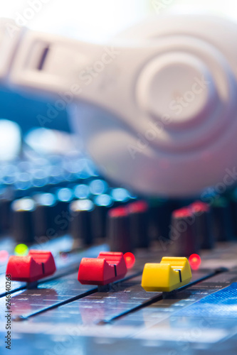 Slide the button to adjust the volume mixer of audio professionals. In the studio recording.