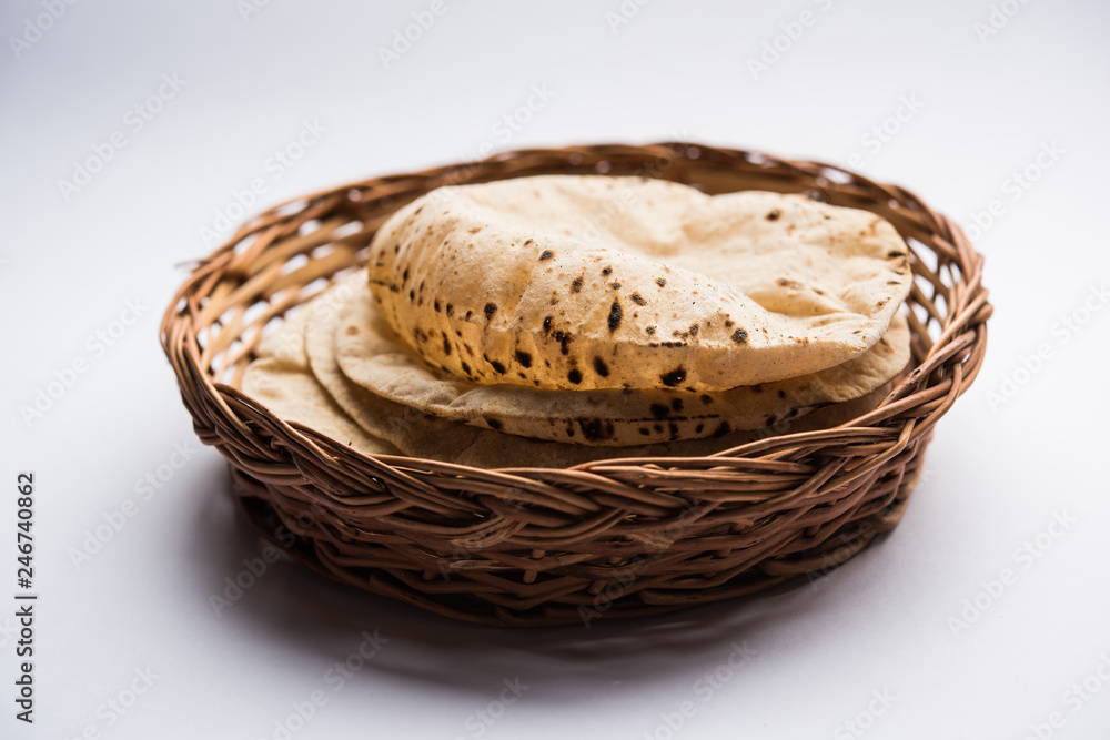 Chapati / Tava Roti also known as Indian bread or Fulka/phulka. Main ingredient of lunch/dinner in India/Pakistan. selective focus Chapati / Tava Roti also known as Indian bread or Fulka/phulka. Main ingredient of lunch/dinner in India/Pakistan. selective focus