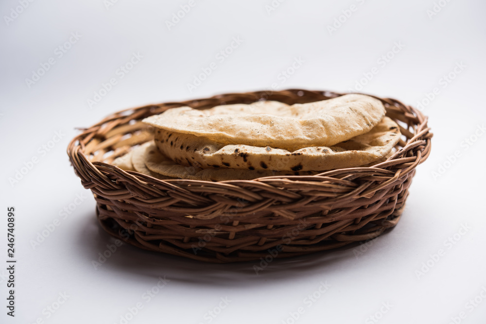 Chapati / Tava Roti also known as Indian bread or Fulka/phulka. Main ingredient of lunch/dinner in India/Pakistan. selective focus Chapati / Tava Roti also known as Indian bread or Fulka/phulka. Main ingredient of lunch/dinner in India/Pakistan. selective focus