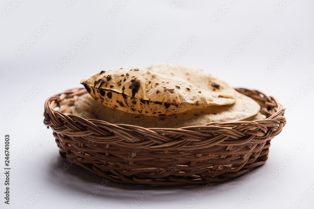 Chapati / Tava Roti also known as Indian bread or Fulka/phulka. Main ingredient of lunch/dinner in India/Pakistan. selective focus Chapati / Tava Roti also known as Indian bread or Fulka/phulka. Main ingredient of lunch/dinner in India/Pakistan. selective focus