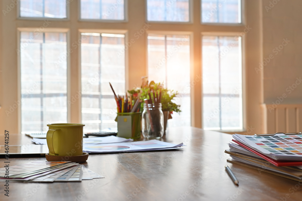 Creative wood desk with colour paper chart and coffee mug. Creative wood desk with colour paper chart and coffee mug.
