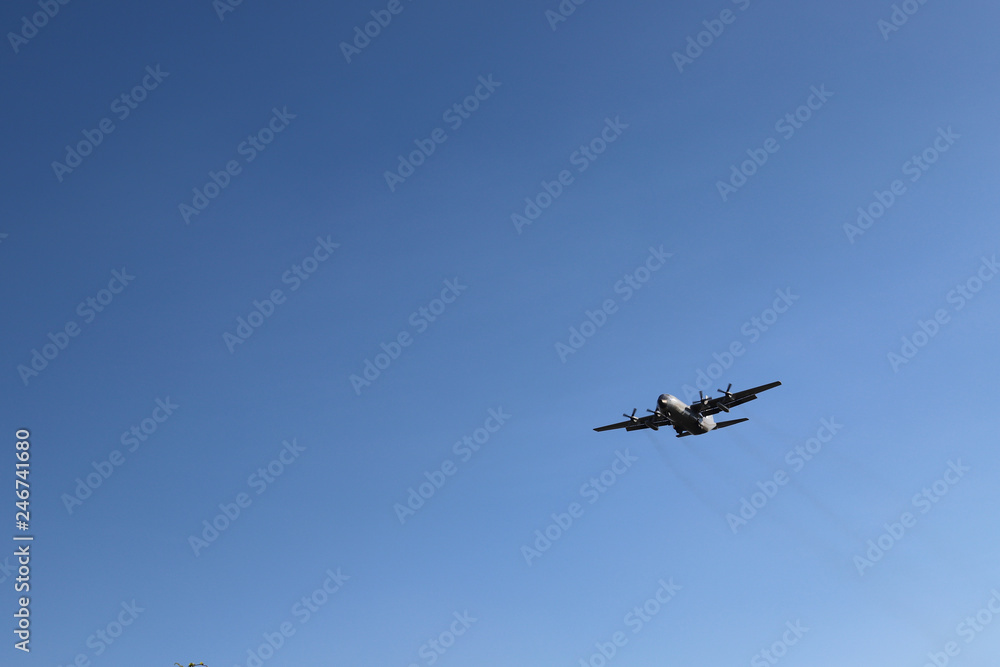 Scenery of airplane flying in clear blue sky of sunny day. The best mean of transportation in modern world. Scenery of airplane flying in clear blue sky of sunny day. The best mean of transportation in modern world.