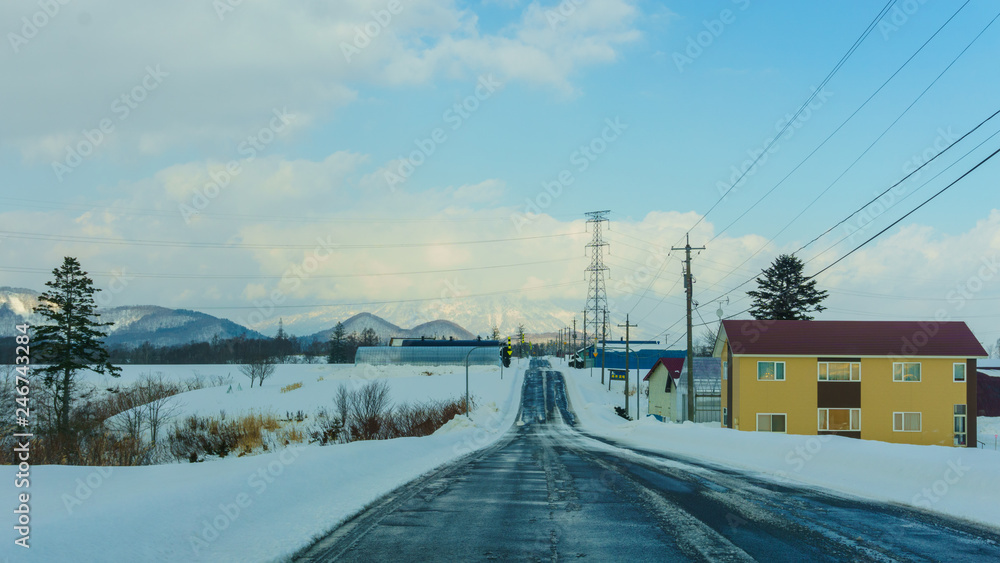 Beautiful Landscape view of long road with snow During winter season at Hokkaido, Japan