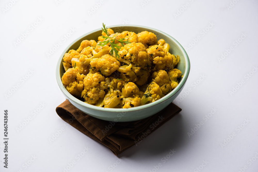 Dry Gobi Masala/ cauliflower Sabzi served in a bowl. selective focus Dry Gobi Masala/ cauliflower Sabzi served in a bowl. selective focus
