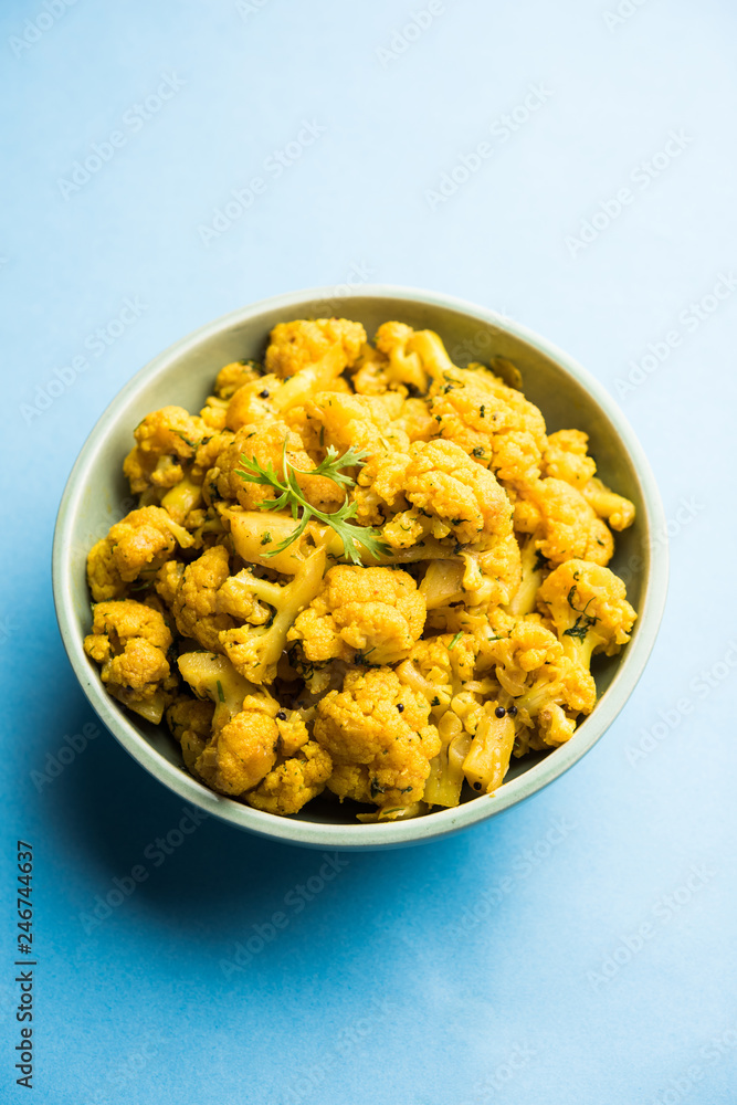 Dry Gobi Masala/ cauliflower Sabzi served in a bowl. selective focus Dry Gobi Masala/ cauliflower Sabzi served in a bowl. selective focus