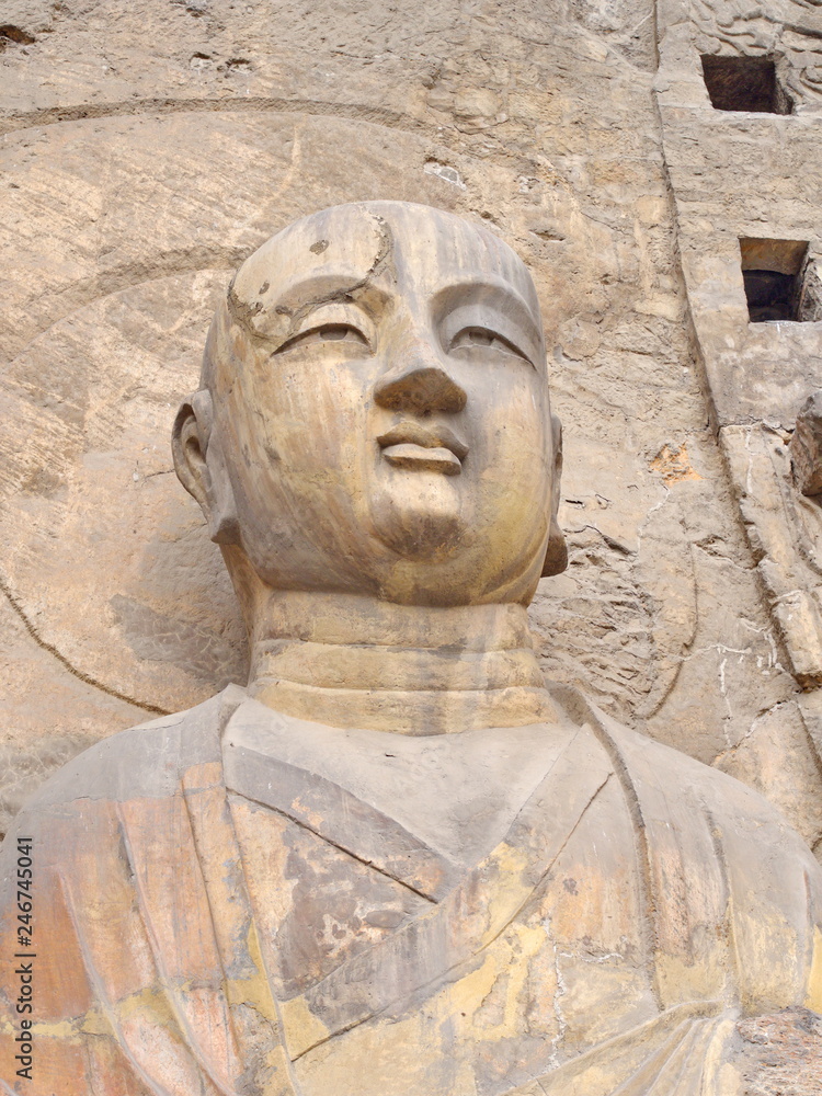 Luoyang Longmen grottoes. Broken Buddha and the stone caves and sculptures in the Longmen Grottoes in Luoyang, China. Taken in 14th October 2018 Luoyang Longmen grottoes. Broken Buddha and the stone caves and sculptures in the Longmen Grottoes in Luoyang, China. Taken in 14th October 2018