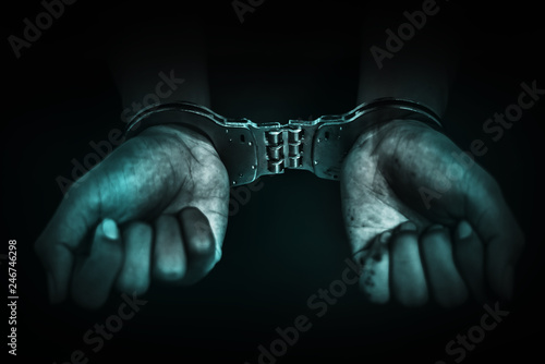 Business Man's hand in handcuff, crime arrested concept