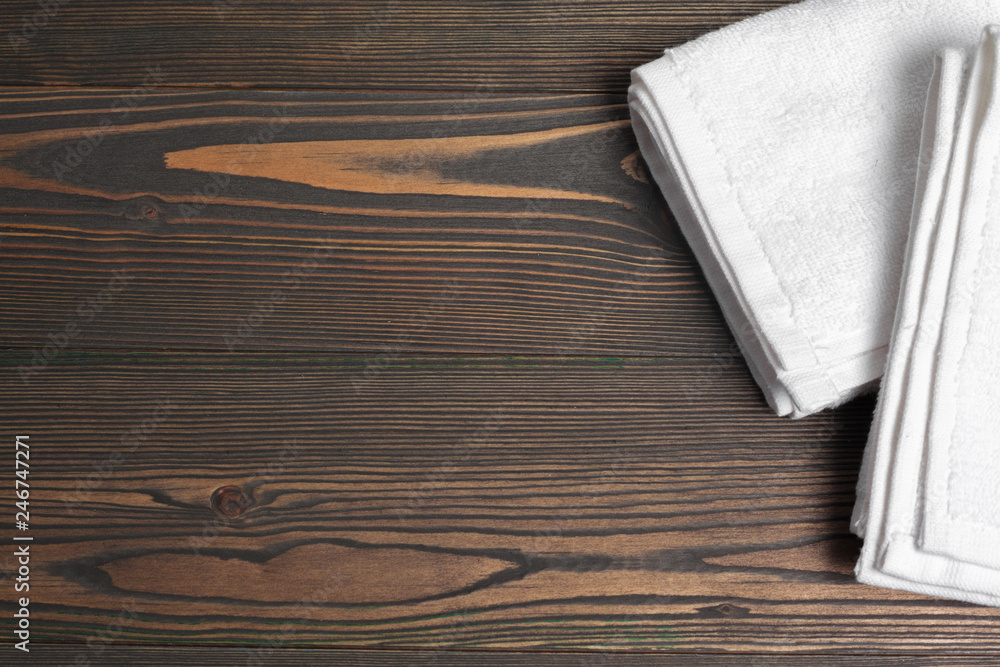 Clean soft towels on wooden table Clean soft towels on wooden table