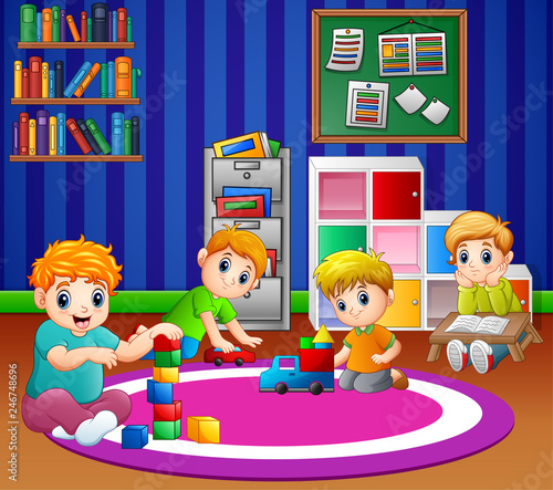 Children playing with toys in playroom of kindergarten