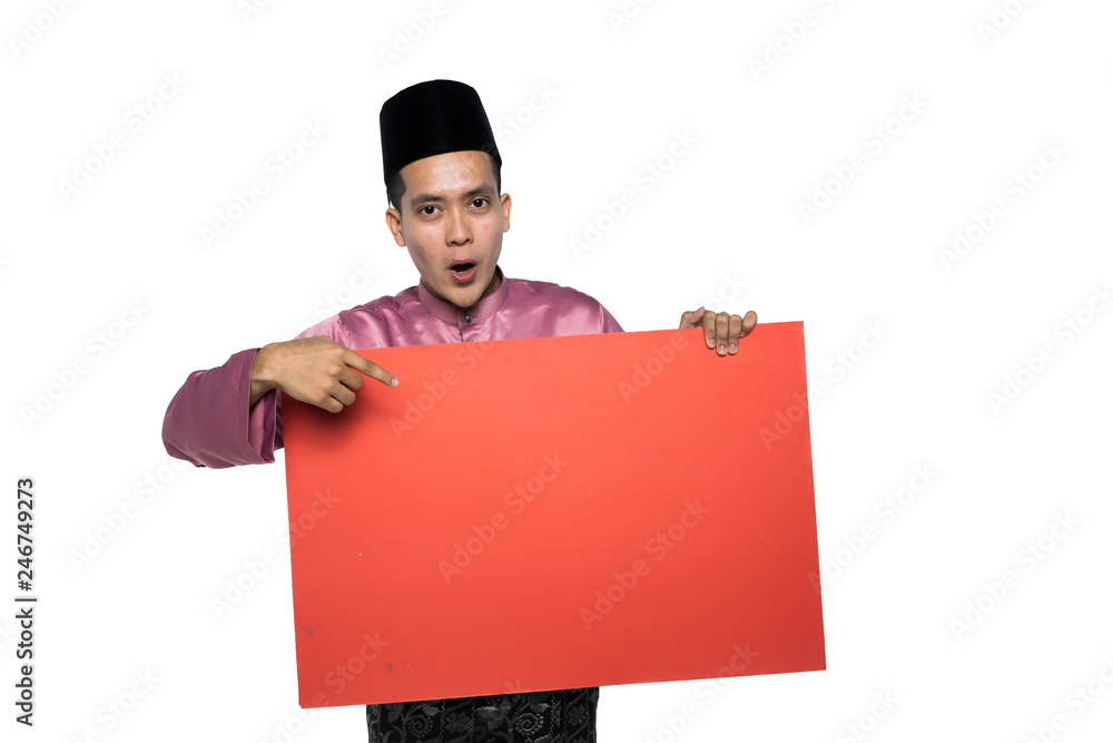 asian man with malay traditional attire holding a promotional card asian man with malay traditional attire holding a promotional card