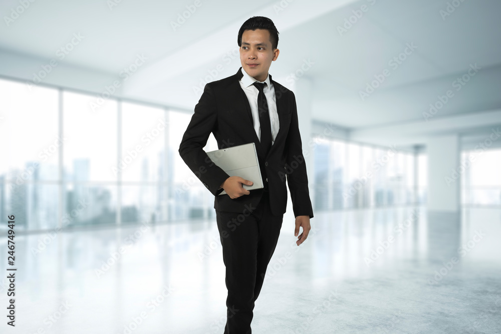 handsome asian man with corporate attire and a tablet handsome asian man with corporate attire and a tablet