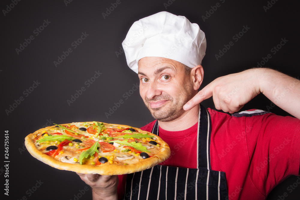 Portrait of happy attractive cook with a pizza Portrait of happy attractive cook with a pizza