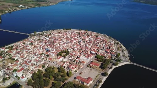 Aerial drone view video of famous island - fishing village of Aitoliko in Aetolia - Akarnania, Greece situated in the middle of Messolongi archipelago known as the Little Venice of Greece photo