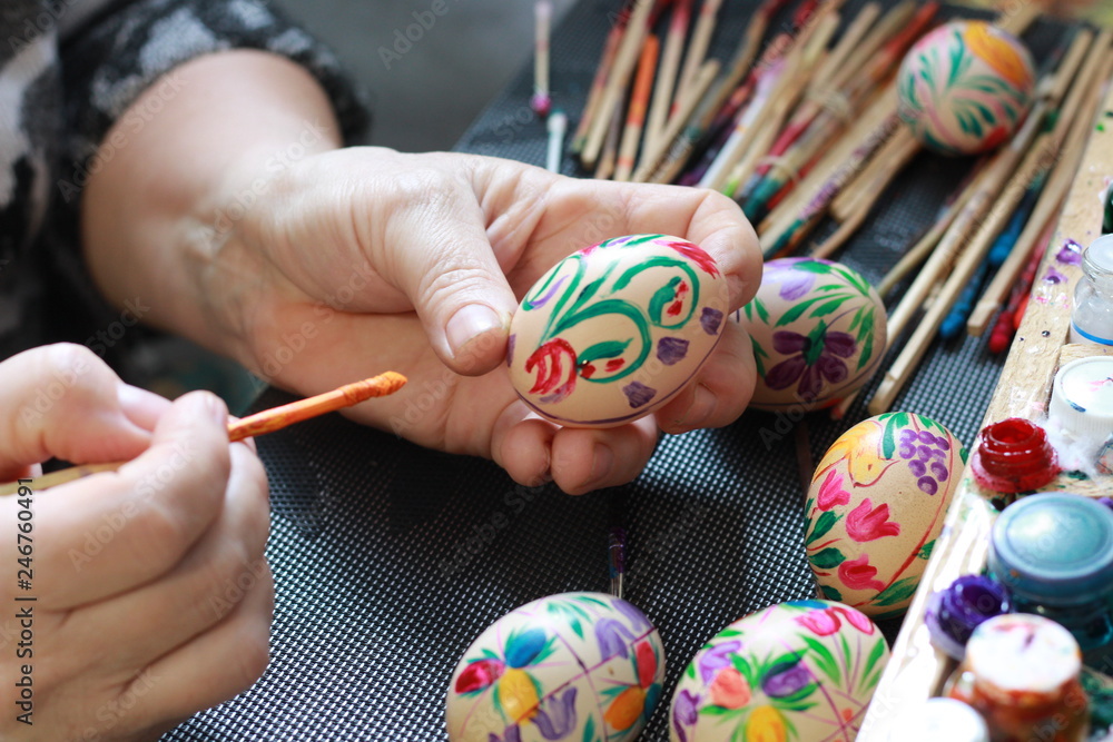handmade painted easter eggs hands of a woman