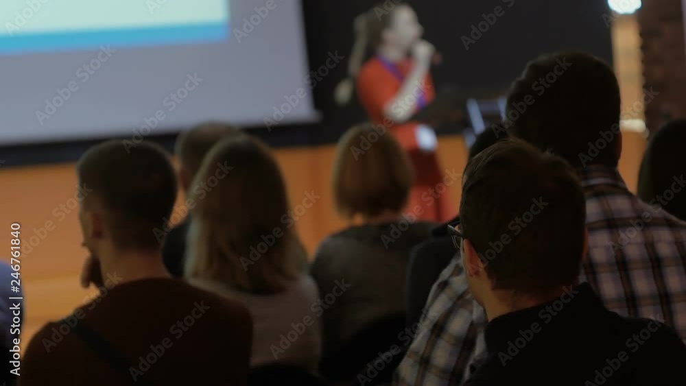 female speaker performs, speaks to the public during business conference or presentation female speaker performs, speaks to the public during business conference or presentation