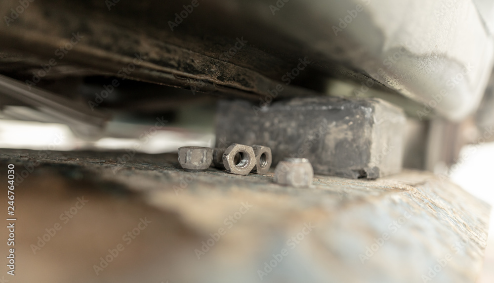 Bolts from the car in the workshop Bolts from the car in the workshop