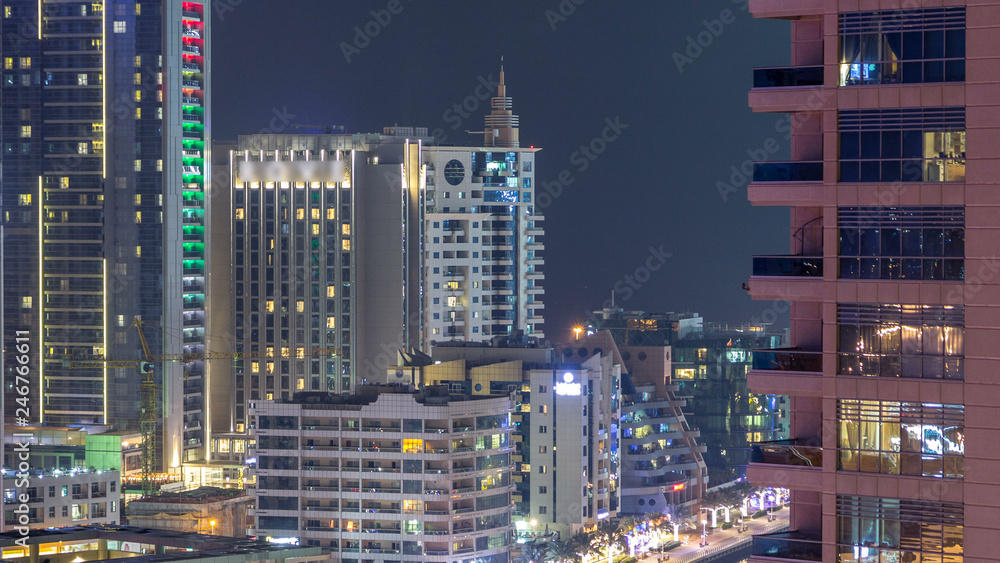 Fototapeta premium Aerial view of Dubai Marina from a vantage point night timelapse.