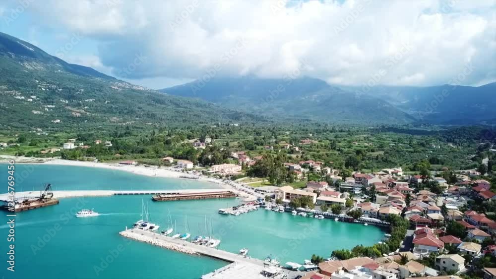 Aerial drone video of iconic seaside village and port of Vasiliki famous for trips to Ionian islands and nearby beaches, Lefkada island, Ionian, Greece Aerial drone video of iconic seaside village and port of Vasiliki famous for trips to Ionian islands and nearby beaches, Lefkada island, Ionian, Greece