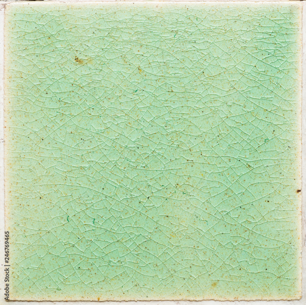 Fototapeta premium background and texture of stretch marks cracked on emerald green glazed tile
