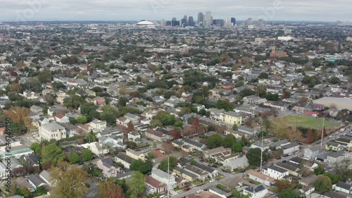 wide arial over NOLA neighborhood of New Orleans facing downtown