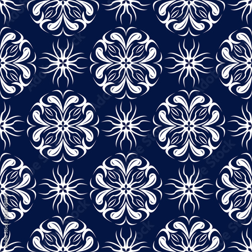 Floral seamless background. White design on dark blue backdrop