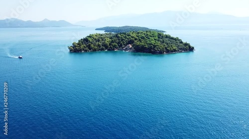 Aerial drone video of iconic uninhabited island of Madouri in bay of Nydri and Mansion of 19th-century poet Aristotelis Valaoritis, Lefkada island, Ionian, Greece photo