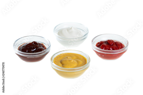 Bowls with sauces isolated on white background