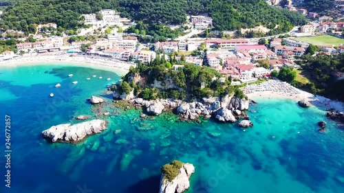Aerial drone bird's eye view video of iconic and picturesque small fishing village of Parga, Epirus, Ionian, Greece photo