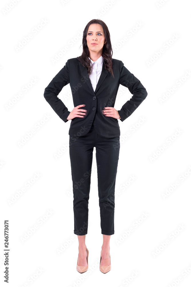 Successful confident businesswoman manager standing with arms on hips looking up. Full body isolated on white background. Successful confident businesswoman manager standing with arms on hips looking up. Full body isolated on white background.
