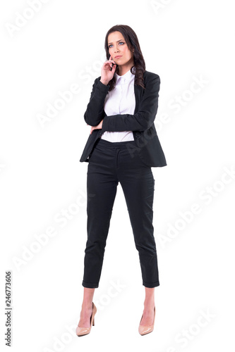 Serious confident business woman watching interested with hand on chin. Attention concept. Full body isolated on white background. 