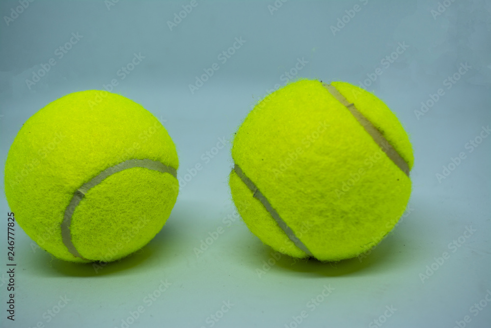 Yellow tennis ball that is sport equipment for tennis as international sport around the world.