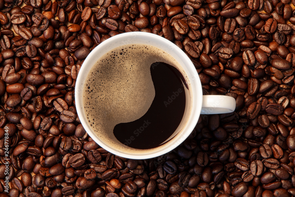 Fototapeta premium cup of coffee with beans