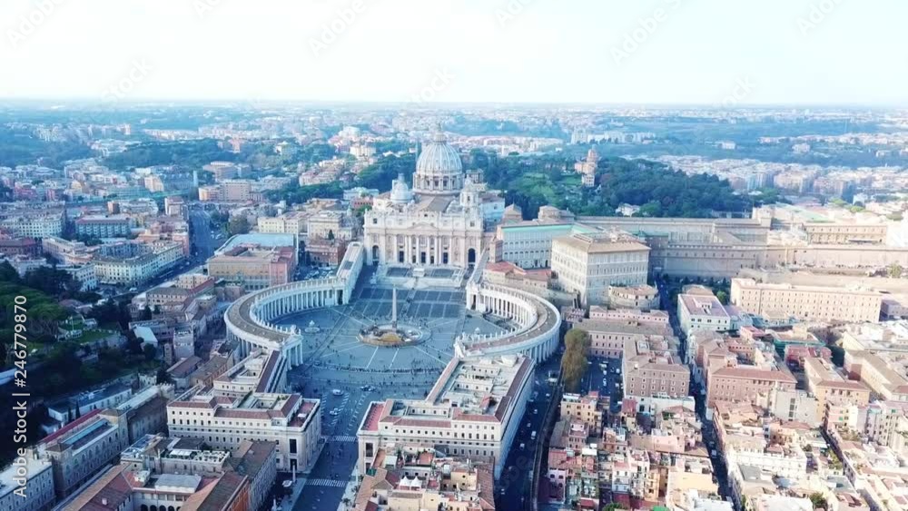 Aerial drone video of Saint Peter's square in front of world's largest church - Papal Basilica of St. Peter's, Vatican - an elliptical esplanade created in the mid seventeenth century, Rome, Italy Aerial drone video of Saint Peter's square in front of world's largest church - Papal Basilica of St. Peter's, Vatican - an elliptical esplanade created in the mid seventeenth century, Rome, Italy