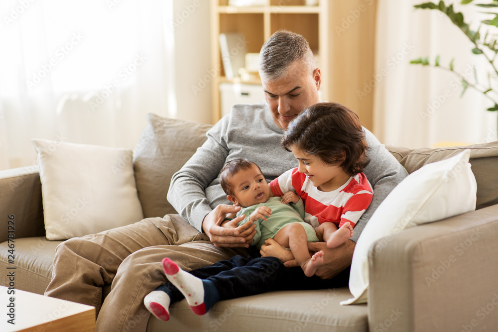 family, fatherhood and people concept - happy father with preteen and baby son at home family, fatherhood and people concept - happy father with preteen and baby son at home