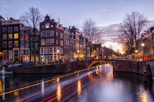 Canvas Print Light Trails in Amsterdam Canal at Sunset