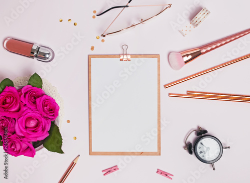 Clip board mock-up on wht table with stylish stationery photo