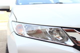 close up of white honda Car headlight and headlamp