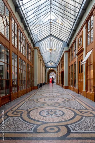 walking inside old galleries in paris
