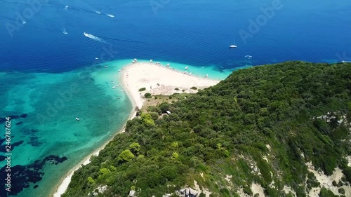 Aerial drone video of tropical island with volcanic caves and exotic emerald sea colour sandy beaches